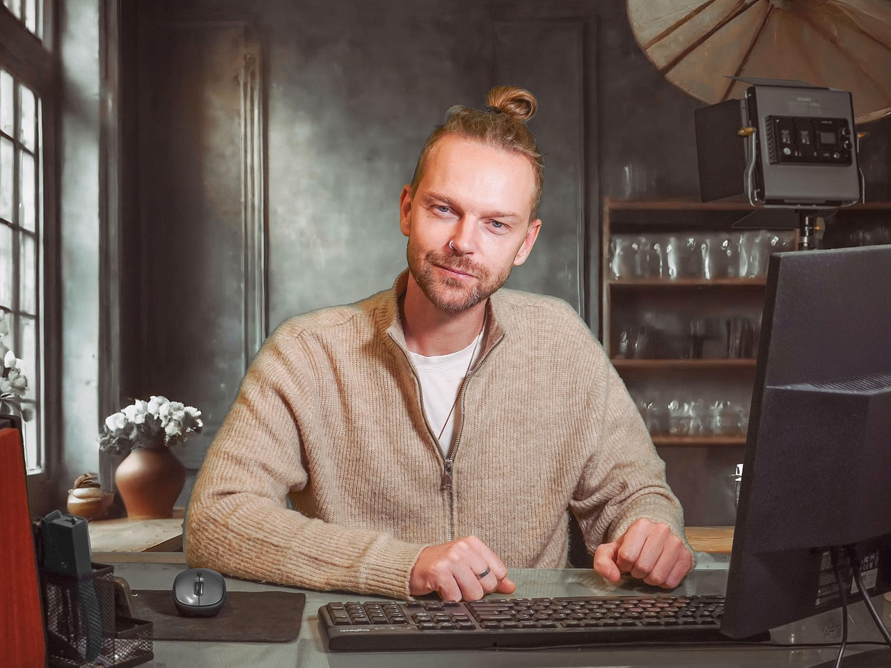 Man sitting at a desk with a computer, representing AI-powered interview preparation.